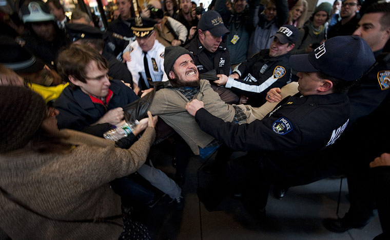 Occupy Day of Action: Occupy Wall Street protester is removed at New York Stock Exchange 