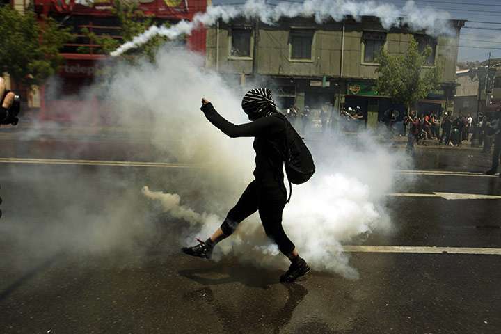 24 hours in pictures: Valparaiso, Chile: A masked protester 