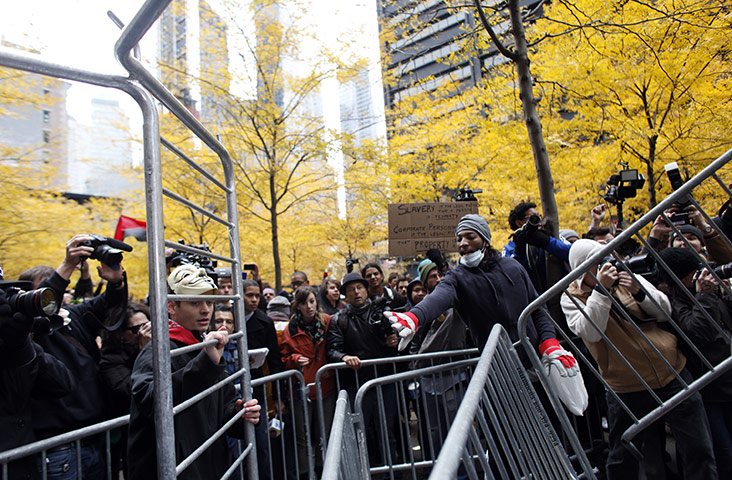 Occupy, Day of Action: Occupy Wall Street protesters remove police barricades in Zuccotti Park