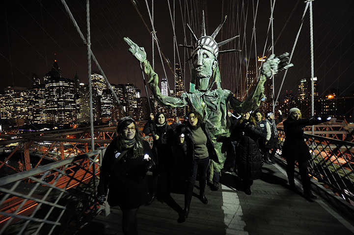 Occupy, Day of Action: Occupy Wall Street carry a puppet of the Statue of Liberty, Brooklyn Bridge