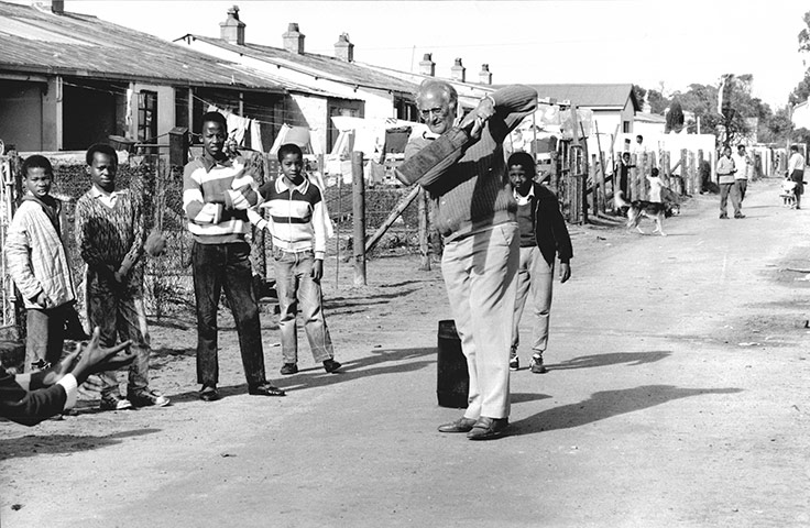 Basil D'Oliveira: Basil D'oliveira plays cricket with children in a Cape Town Township