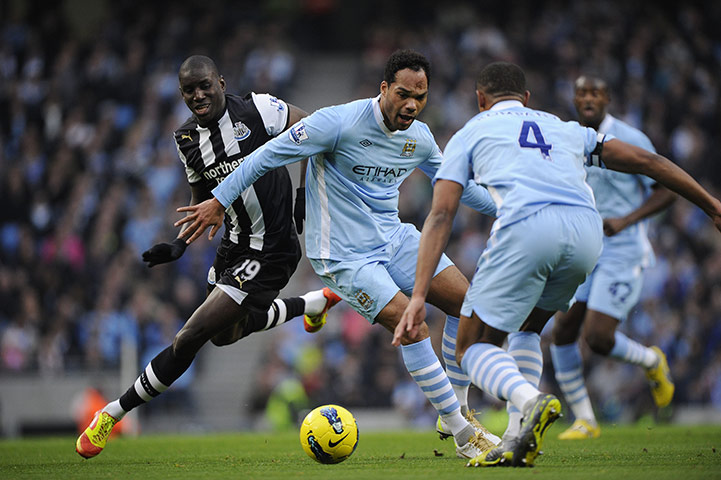 Man City v Newcastle: Demba Ba finds his way blocked by Lescott and Kompany