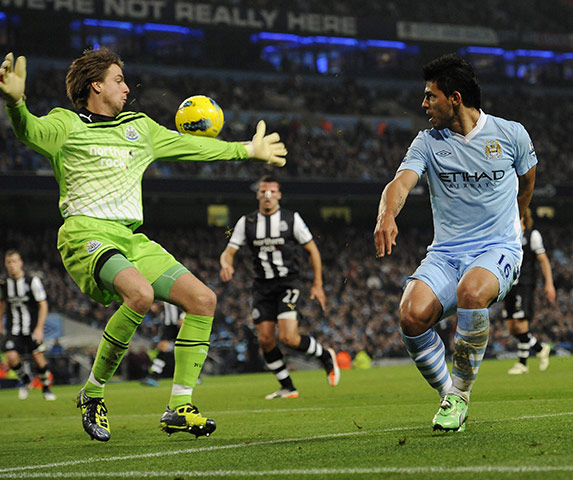 Man City v Newcastle: Sergio Aguero flicks the ball past Tim Krull