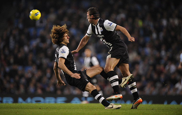 Man City v Newcastle: Coloccini and Taylor collide going for same ball