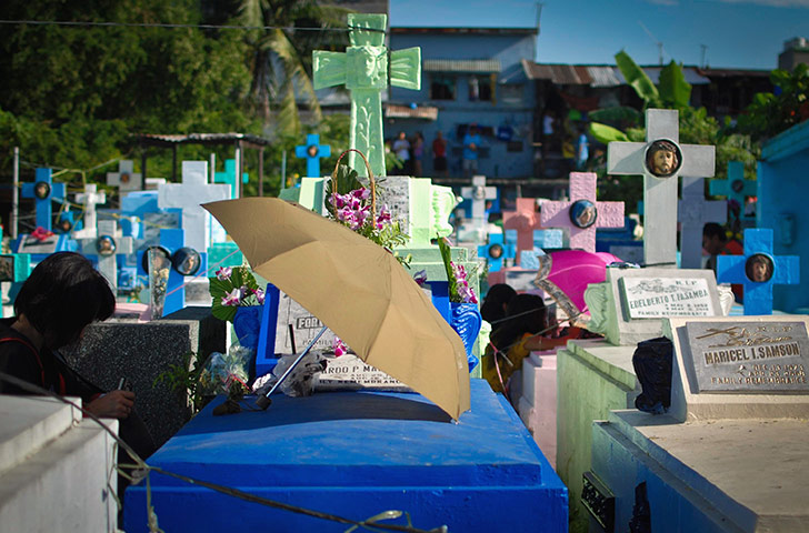 All saints day: Families visit their departed ones at the Manila North Cemetery