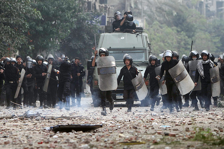 Tahrir square: Egyptian riot police are seen on the move during clashes with protesters