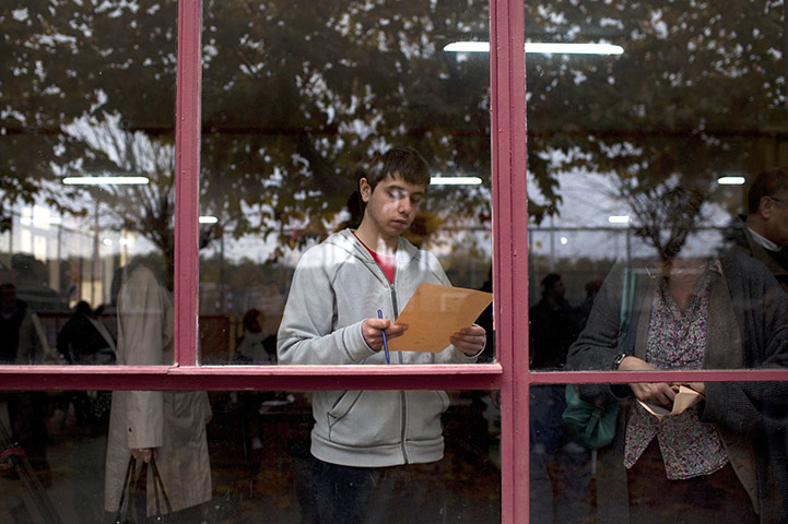 24 hours in pictures: People choose their candidates before casting their vote in Madrid