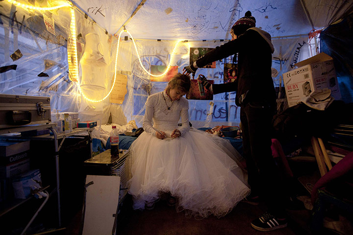 24 hours in pictures: n Occupy Amsterdam demonstrator prepares for her wedding in a tent