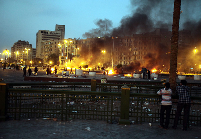 Cairo protests: Makeshift tents burning after after the Egyptian army entered Tahrir square