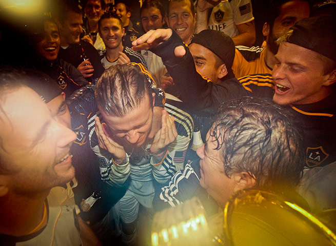 Beckham MLS: David Beckham, center left, celebrates with his teammates