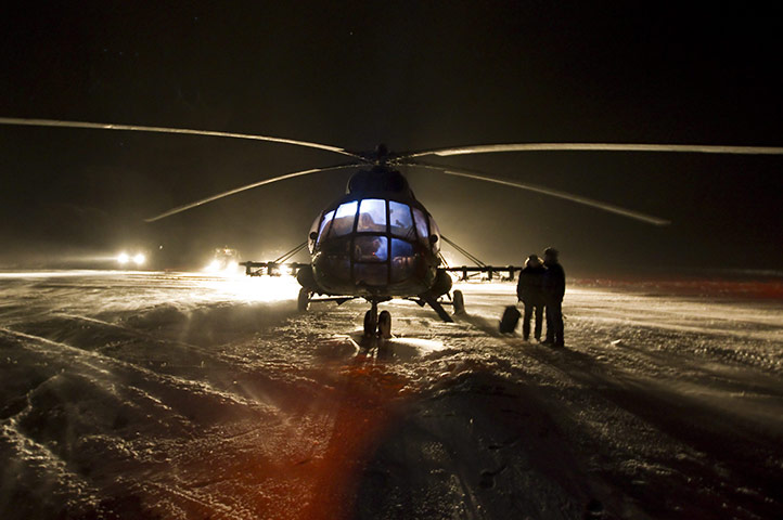 Soyuz landing Kazakhstan : A helicopter crew gets ready at Arkaly airfield, Kazakhstan 