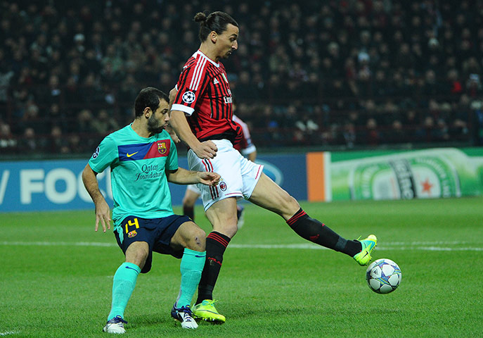 Wed Champions League: AC Milan's Zlatan Ibrahimovic and Barcelona's Javier Mascherano 
