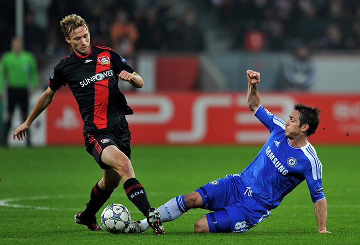 Wed Champions League: Frank Lampard  slides in to dispossess Simon Rolfes