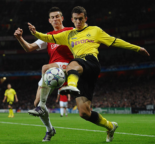 Wed Champions League: Laurent Koscielny tussles with Sebastian Kehl