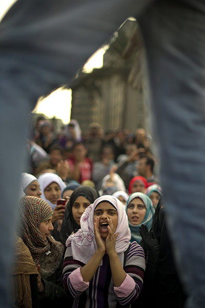 Egypt protests day 6: An Egyptian woman shouts slogans during a demonstration in Tahrir Square