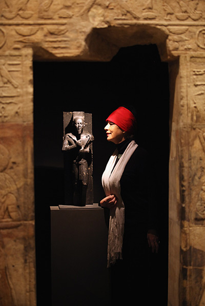 24 hours in pictures: Woman views a statue of King Taharqa at The Ashmolean Museum, Oxford