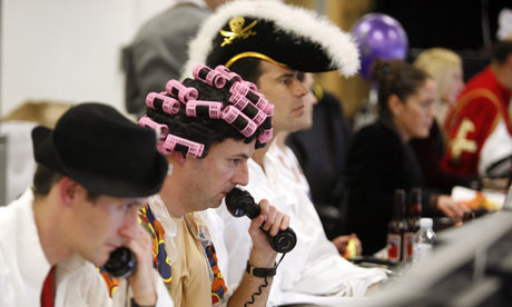 Financial traders in fancy dress costumes for charity day.