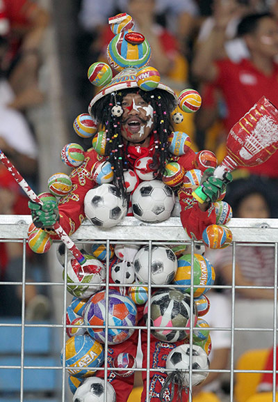 best of the week in sport: A Indonesian fan celebrates after his team beat Vietnam at the SEA games