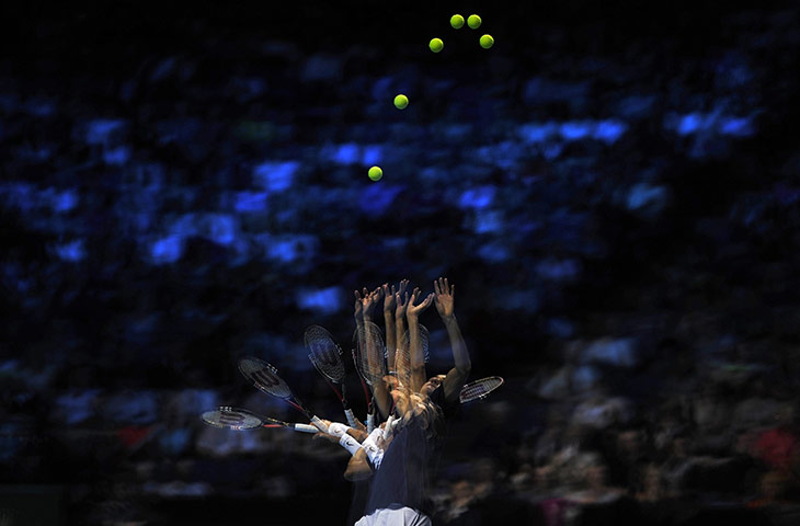 best of the week in sport: Roger Federer serves to Mardy Fish at the ATP World Tour Finals