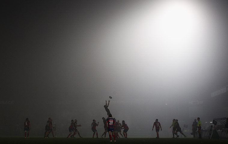 best of the week in sport: Players take a line out as the mist decends over the ground 