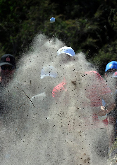 best of the week in sport: Webb Simpson hits out of a bunker at the Presidents Cup