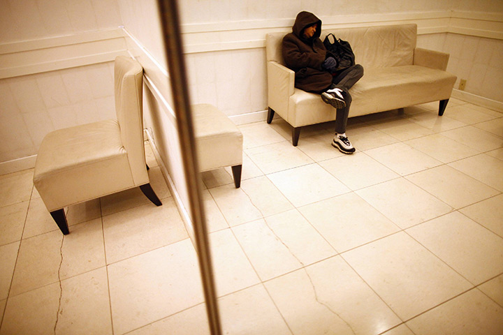 black friday: A customer catches up on sleep at Macy's department store in New York 