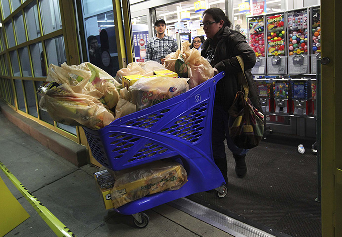 black friday: A shopper leaves the Toys R Us store in Westbury, New York