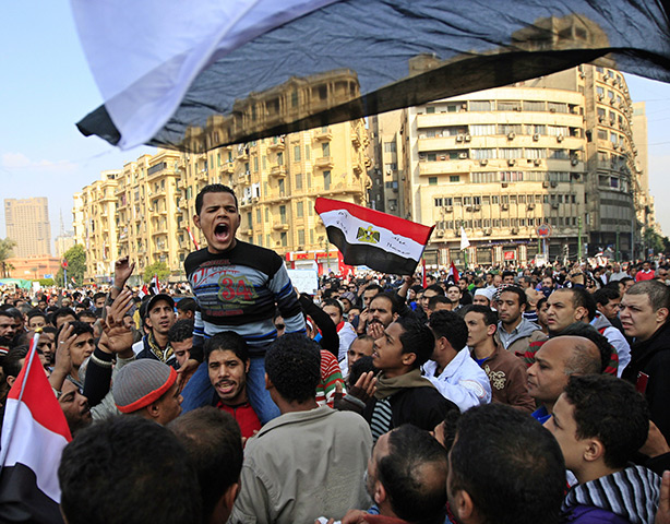 Tahrir Square: Protesters  shout slogans against the ruling military council 