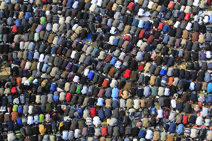Tahrir Square: Demonstrators take part in Friday prayers 