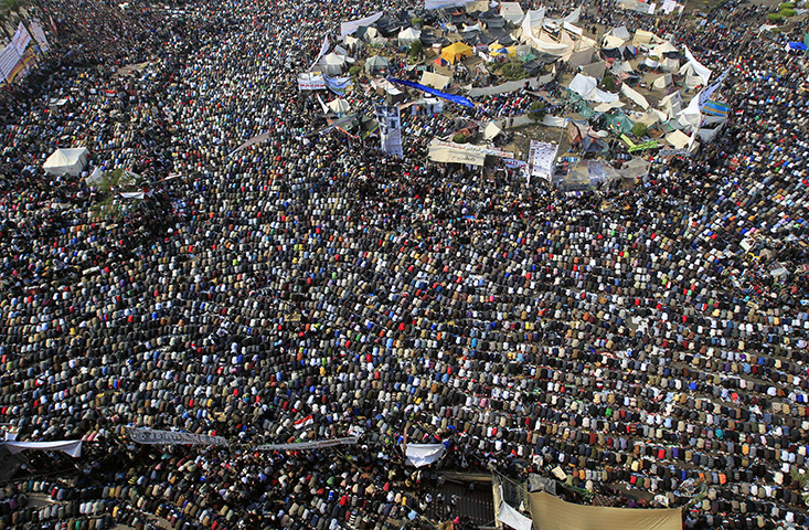 Tahrir Square: Large crowds of protesters take part in Friday prayers