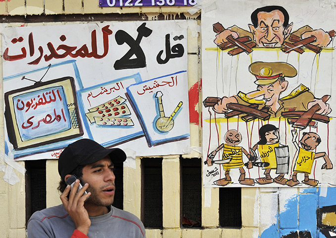 Tahrir Square: A protester talks on his mobile phone