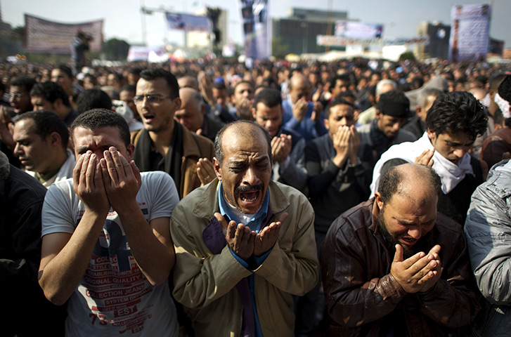 Tahrir Square: Egyptian men perform the Friday prayer in Tahrir square 