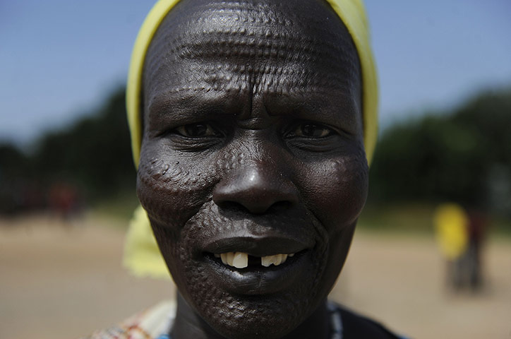 24 hours: A woman with traditional marks made through tiny incisions on her face