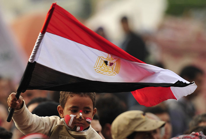 Tahrir Square: A child holds an Egyptian flag