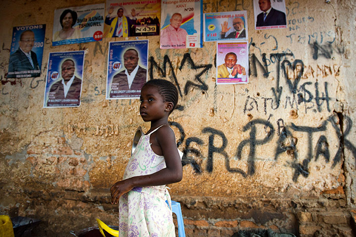 24 hours in pictures: Lubumbashi, Democratic Republic of Congo: A young girl stands in a shelter