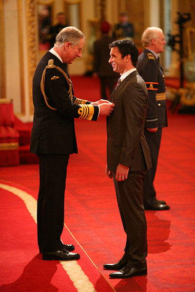 Gary Speed career: Gary Speed receives an MBE from the Prince of Wales
