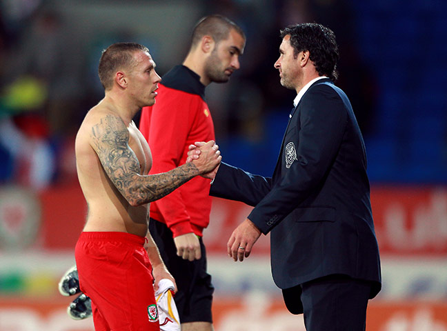 Gary Speed career: Wales Manager Gary Speed shakes hands with Craig Bellamy 