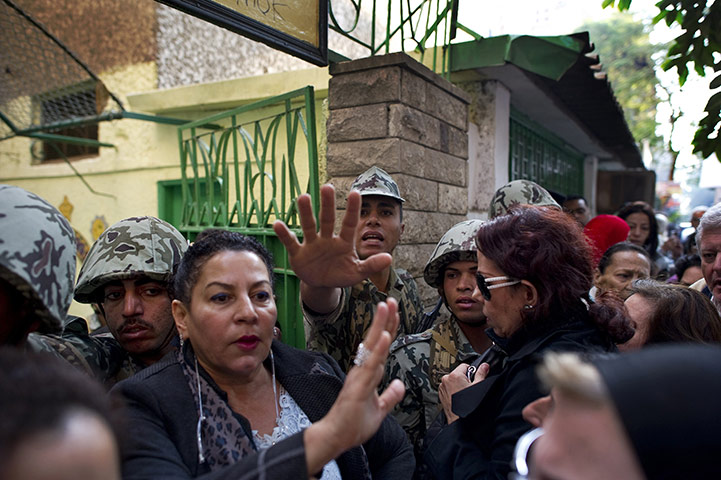 Egypt elections: Egyptian soldiers and election officials maintain calm as voters queue