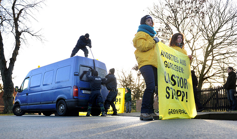 Germany  protests: Police officers try to open a van containing Greenpeace activists  