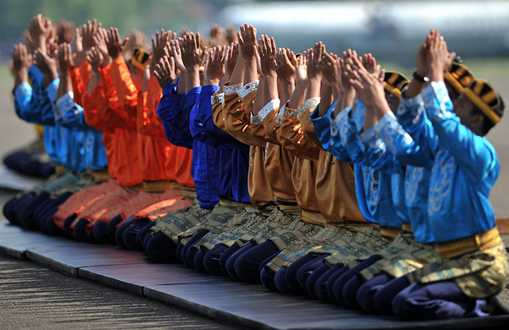 Intangible heritage: Members of the Indonesian airforce perform an Acehnese 'Saman' dance