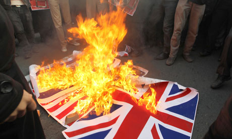 Iranian protesters burn the union flag outside the British embassy in Tehran