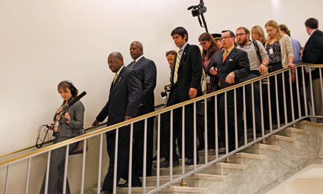 Herman Cain trailed by reporters