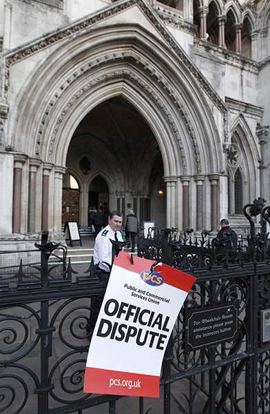 public sector strikes: A placard is seen outside the High Court in central London