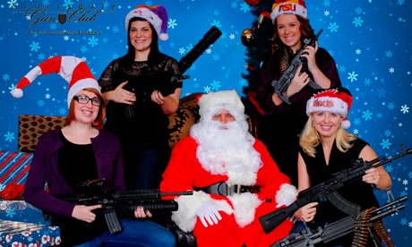 Scottsdale Gun Club members posing with Santa Claus and several guns