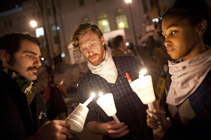 Occupy LA evictions: Occupy LA members light candles