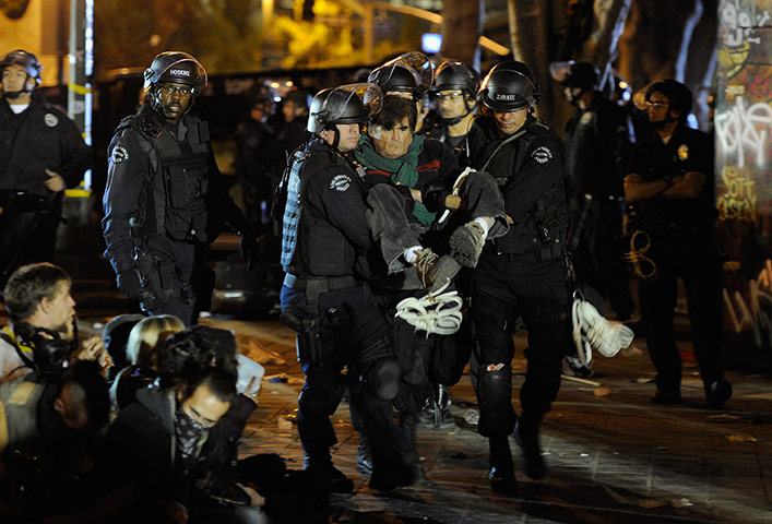 Occupy LA evictions: Protester is arrested at the encampment after LAPD raided their campsite