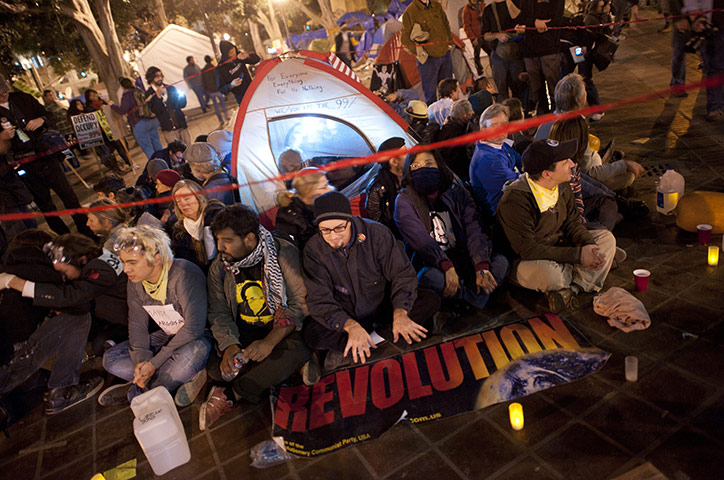 Occupy LA evictions: Protesters sit on the floor as they wait for the LAPD to move in
