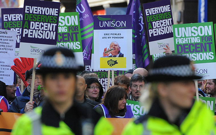Strikers march: Demonstrators march with trade union placards in Manchester 
