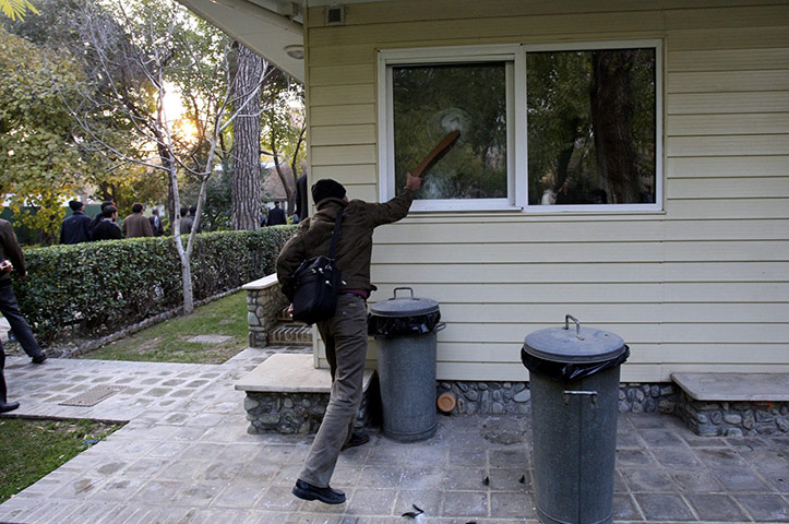 British Embassy, Iran: An Iranian man breaking a window inside the grounds of the British embassy
