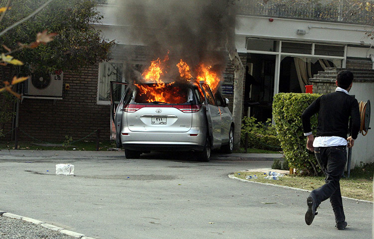 British Embassy, Iran: A burning diplomatic vehicle inside the grounds of the British embassy